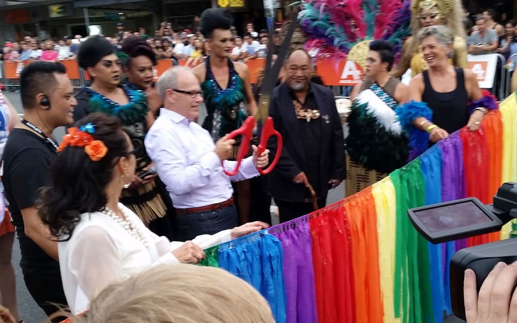 Auckland Mayor Len Brown cuts the ribbon at the Auckland Pride Parade.