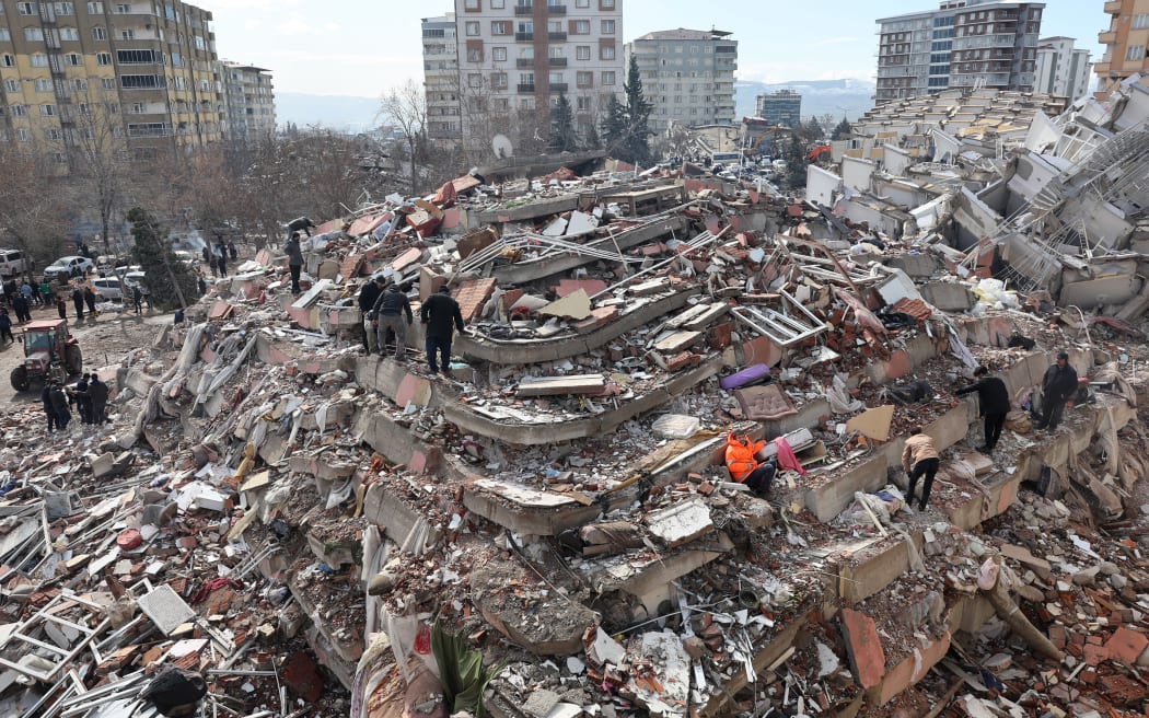 Civilians look for survivors under the rubble of collapsed buildings in Kahramanmaras, close to the quake's epicentre, the day after a 7.8-magnitude earthquake struck Türkiye on February 7, 2023.