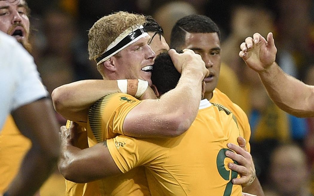 Wallabies number eight David Pocock is congratulated by teammates after scoring against Fiji.