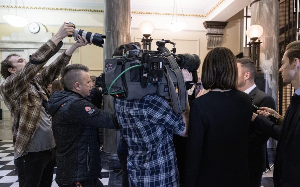 Rob Kitchin taking photos of MPs on Parliament's 'Tiles'.