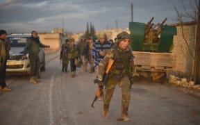 Members of Free Syrian Army move to al-Bab town of Aleppo during the "Operation Euphrates Shield" in Syria on December 16