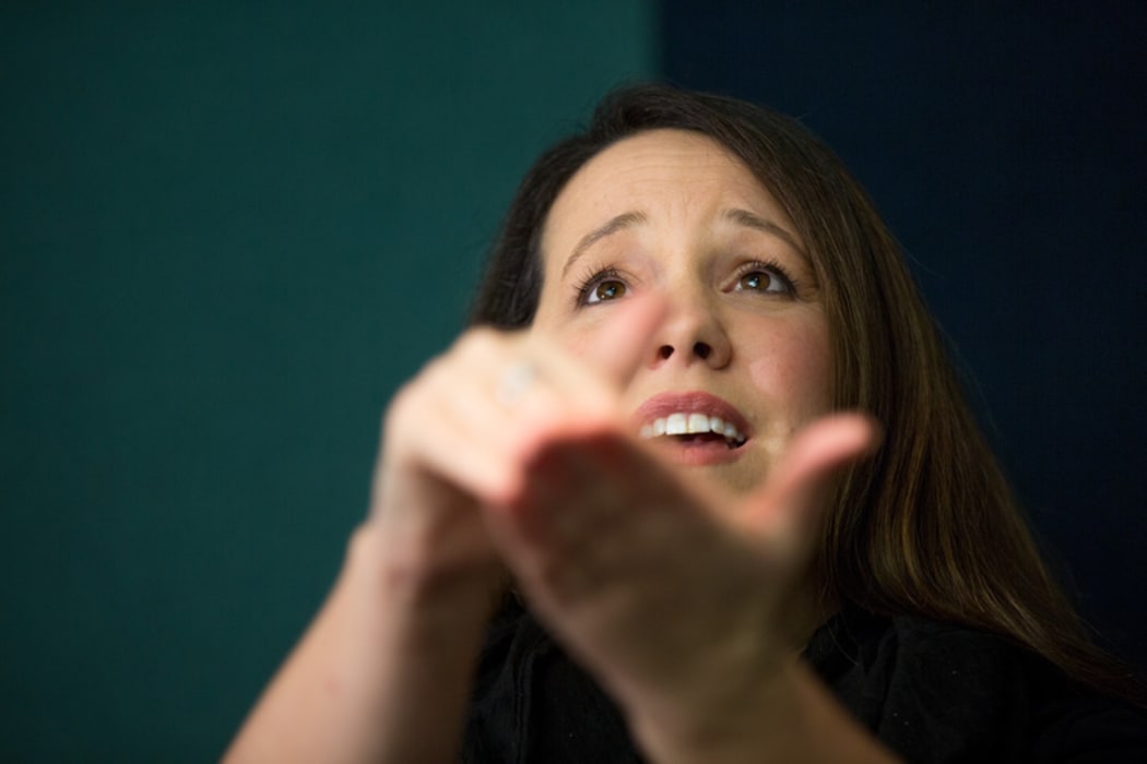 Kelly Hodgins signs some music at RNZ.