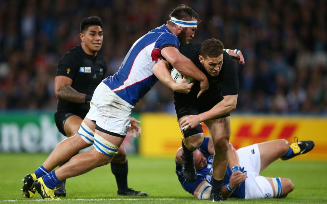 Tawera Kerr-Barlow is tackled by PJ Van Lill during the 2015 Rugby World Cup Pool C match between New Zealand and Namibia.