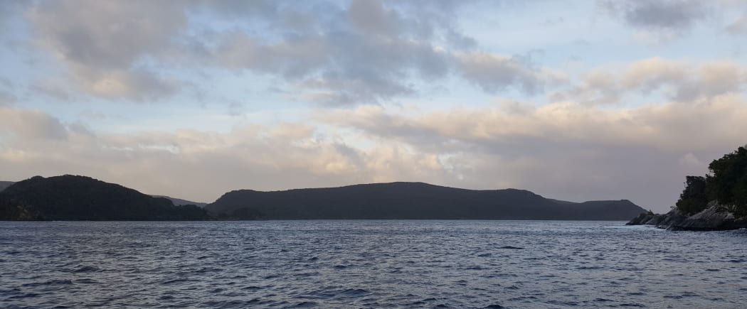 Looking west down Preservation Island towards the low, brooding shape of Coal Island.
