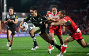 Kiwis player Shaun Johnson scores his second try against Tonga, during rugby league Test match between Kiwis and Tonga, held at Mt Smart Stadium on 22 June.