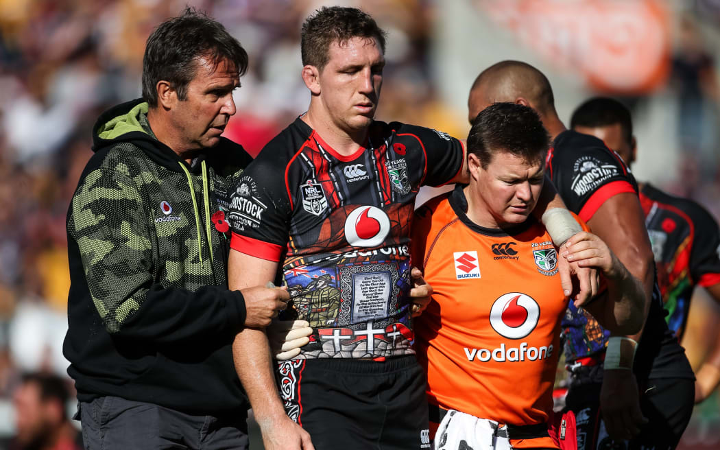 A concussed Warriors forward Ryan Hoffman leaves the field.
