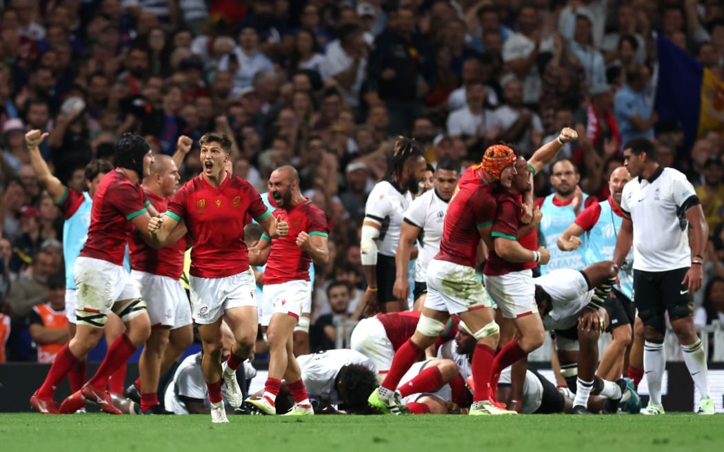 Francisco Fernandes of Portugal celebrates with teammates after scoring his team's second try during the Rugby World Cup France 2023 match between Fiji and Portugal (Photo by Julian Finney - World Rugby/World Rugby via Getty Images)