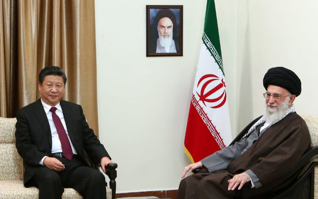A handout picture provided by the office of Iran's supreme leader Ayatollah Ali Khamenei shows him (R) meeting with Chinese President Xi Jinping in Tehran on 23 January, 2016.