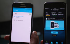 Mobile phones showing Lambubu School's wireless connection and download speed in Vanuatu.