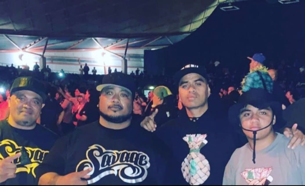 Toko Manuel, centre-right, and his son Justin, far right, with Savage after a concert.
