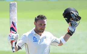 Brendon McCullum celebrates a world record test century.