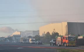 Fire crews tackle a blaze at the Green Gorilla waste management plant in Onehunga, Auckland, for a second day, 8 February 2024.