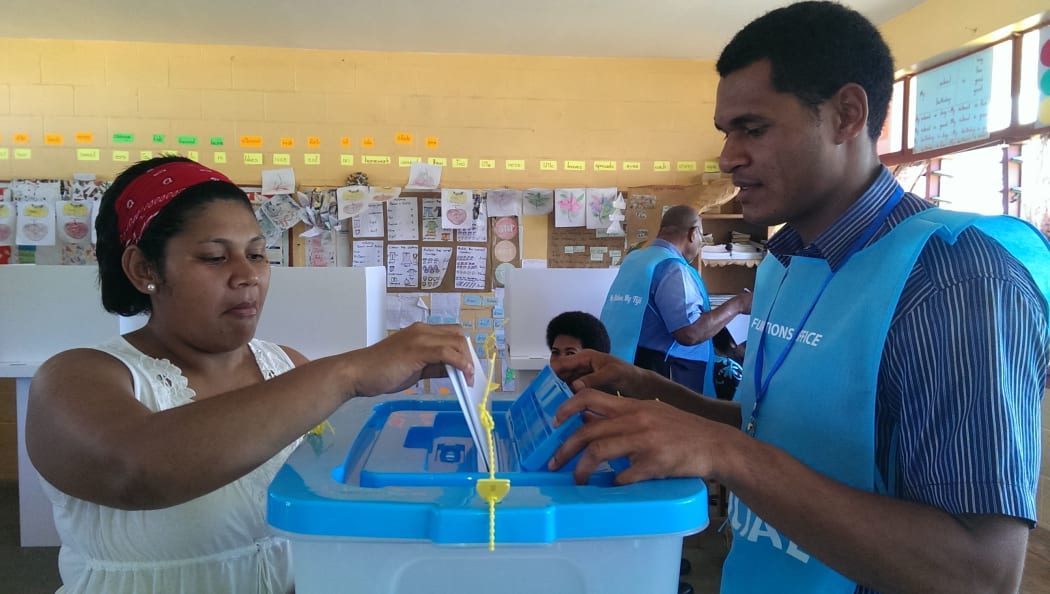 A woman votes in the Fiji elections.