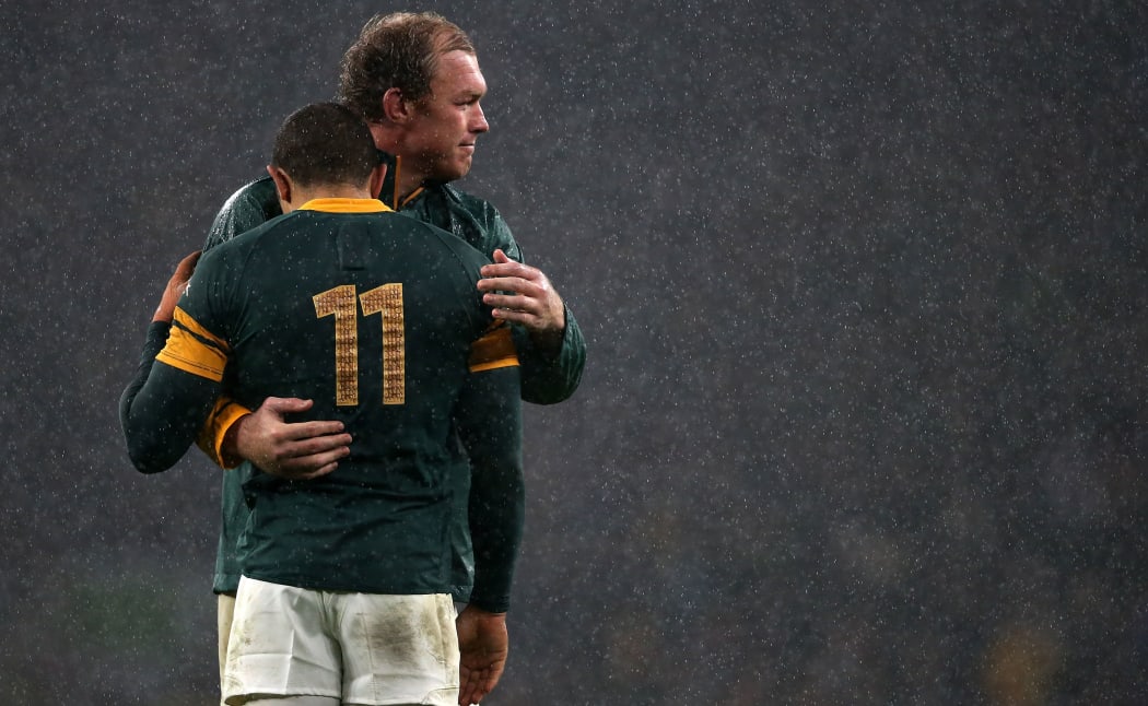 South Africa's Schalk Burger consoles team mate Bryan Habana at the final whistle.