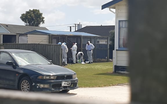 Forensic teams at the Hawera property.