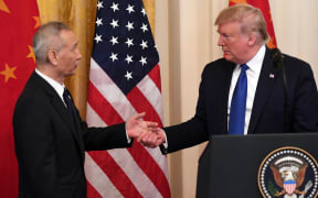 US President Donald Trump, shakes hands during a press conference with Chinas Vice Premier Liu He(L), the countrys top trade negotiator.