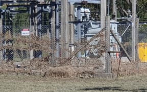 Floodwaters left grass stuck in the Tīnui substation fence. Power is now back on.