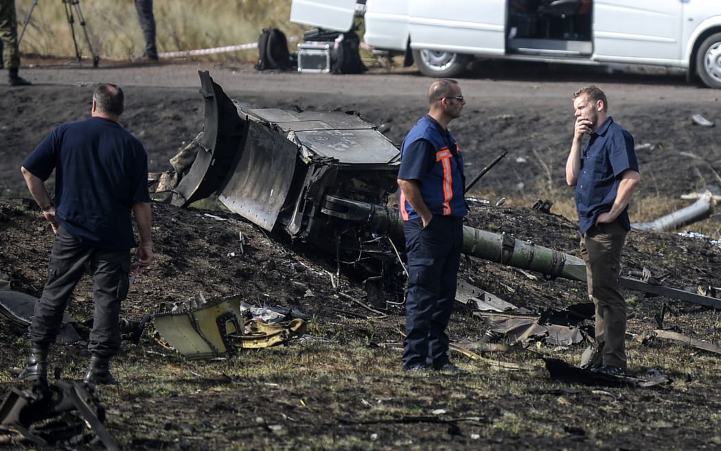 Investigators at the crash site were hampered by heavy fighting in the area.