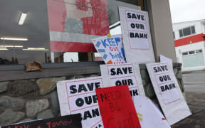 Protests are taking place as Westpac considers closing 19 branches across the country.