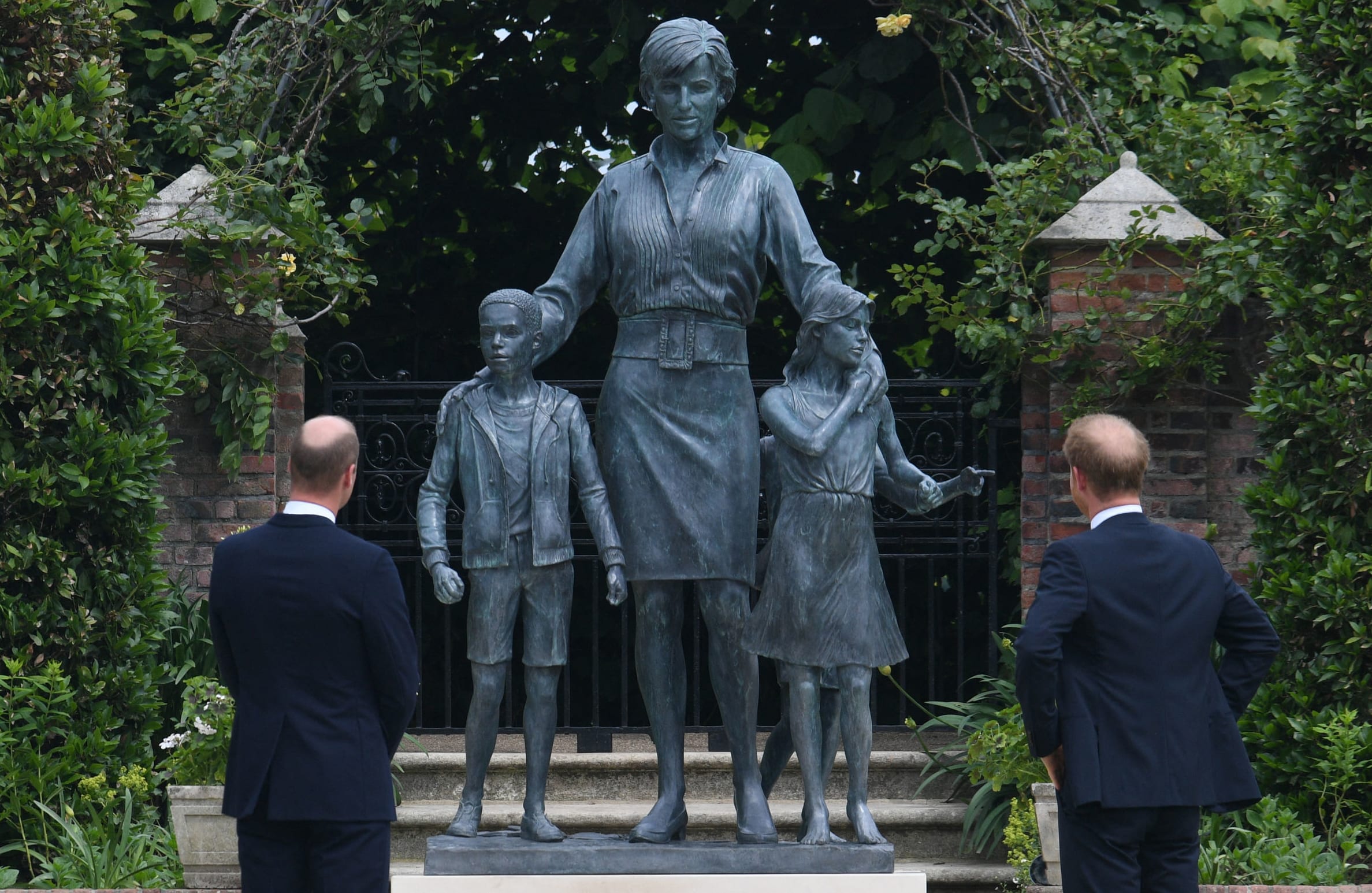 Prince William, Duke of Cambridge, left, and Prince Harry, Duke of Sussex unveil a statue of their late mother, Princess Diana at The Sunken Garden in Kensington Palace, London on 1 July, 2021, which would have been her 60th birthday.