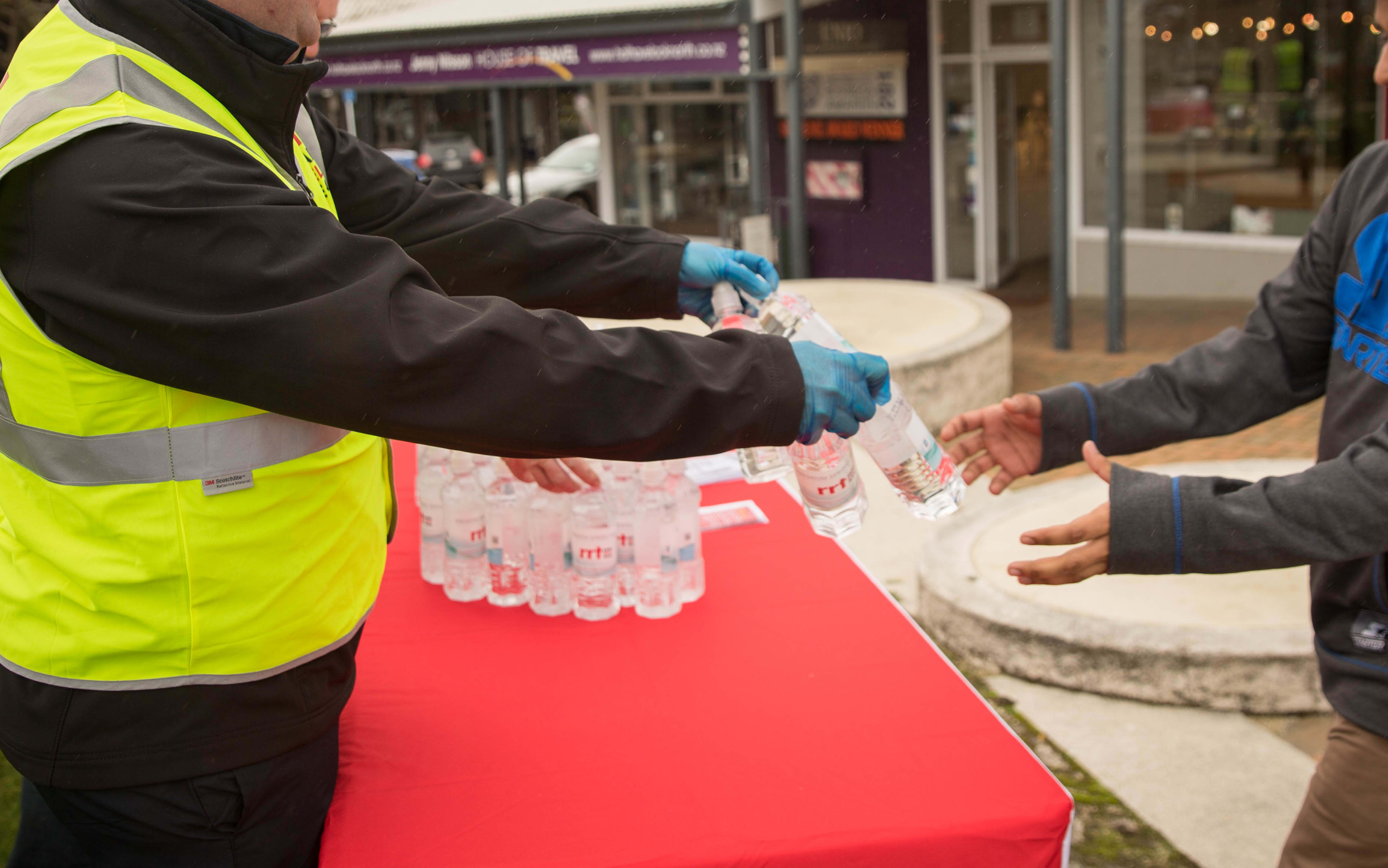 Red Cross volunteers handing out water in Havelock North. 20 August 2016.