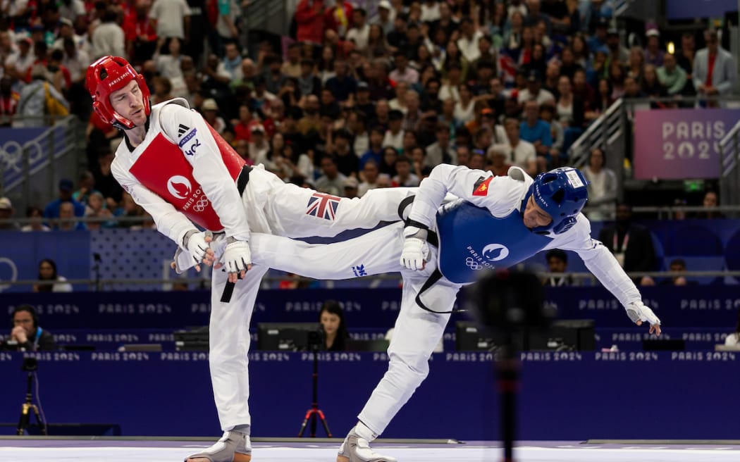 Kevin Solo KASSMAN of Papua New Guinea competes in Olympic taekwondo at the Grand Palais in France on August 8, 2024 (Photo: Casey Sims/ONOC Communications)