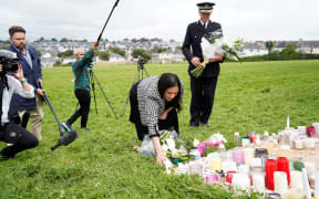 Britain's Home Secretary Priti Patel arrives to lay a floral tribute to the victims of the August 12 shootings in Plymouth, in North Down Crescent Park in the Keyham area, southwest England.