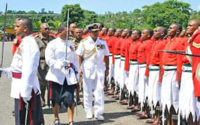 Fiji PM Frank Bainmarama inspects a military pass out parade.