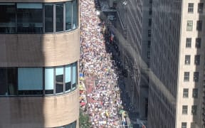 Protesters march through New York as the UN Climate Summit opens.