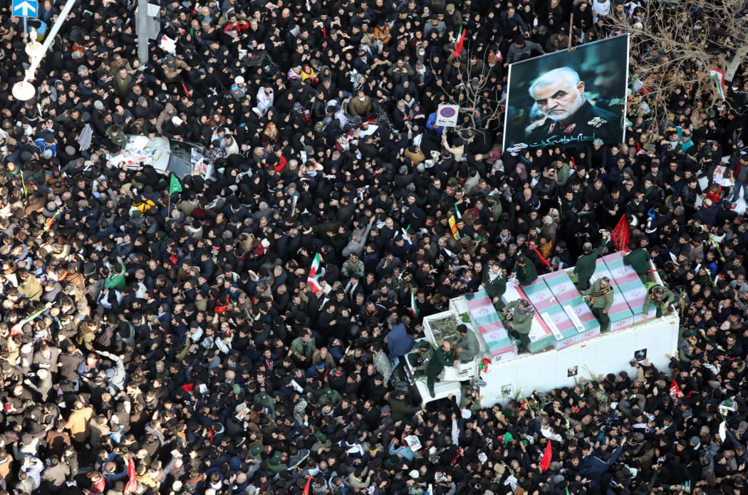 Massive crowds attend the funeral of military commander Qassem Soleimani, killed in a US drone attack.