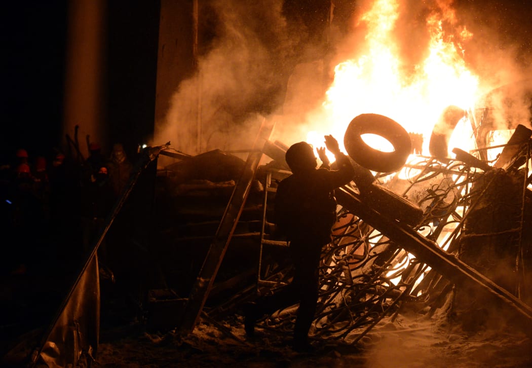 Barricades were set on fire in the latest clash in Kiev.