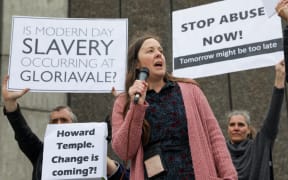 Former members of Gloriavale protest at the Christchurch leaders debate, urging the Prime Minister to launch an inquiry into the sect.