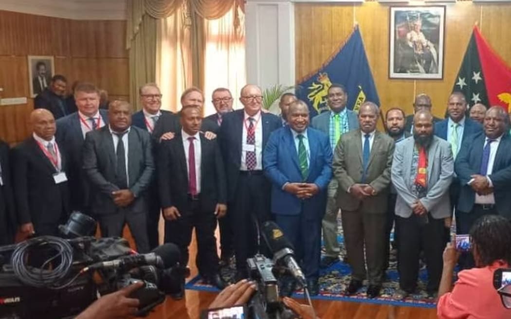 Antonio Bosso (fourth from left), Noe Vicca (seventh from left) and Gilberto Maggiolo (eighth from left),  and  were in PNG when the deal was signed in October.  (Supplied)
