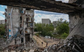 IZYUM CITY, KHARKIV REGION, UKRAINE - SEPTEMBER 19: A view of destruction in the Izyum city, Kharkiv region, Ukraine, on September 19, 2022. The city was destroyed by Russian attacks and was recaptured by the Ukrainian forces on September 10 of this year. Sofia Bobok / Anadolu Agency (Photo by SOFIA BOBOK / ANADOLU AGENCY / Anadolu Agency via AFP)