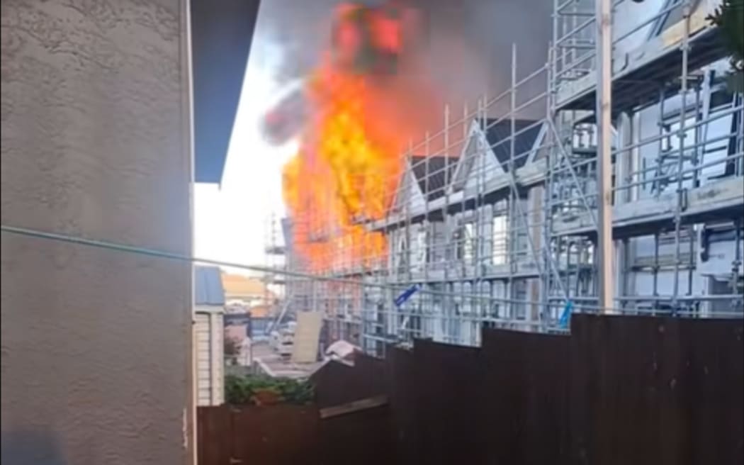 A FENZ spokesperson said approximately half of the units in the block were on fire.