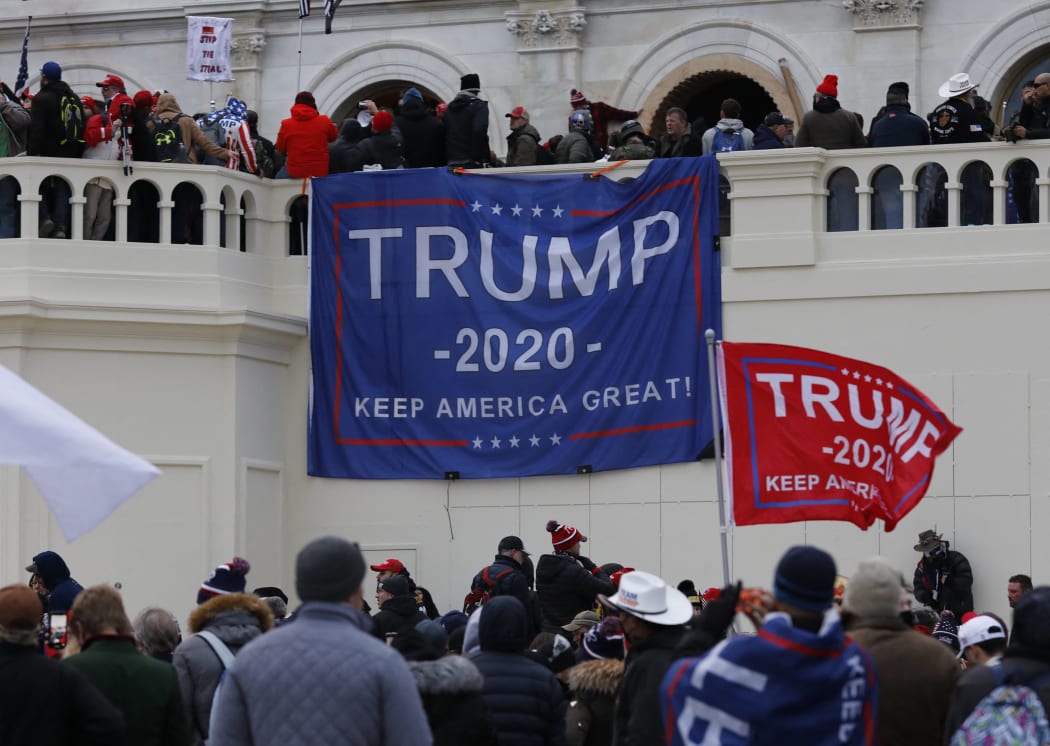 Supporters of US President Donald Trump storm the US Capitol during a rally to contest the certification of the 2020 US presidential election results by Congress at the Capitol Building in Washington.