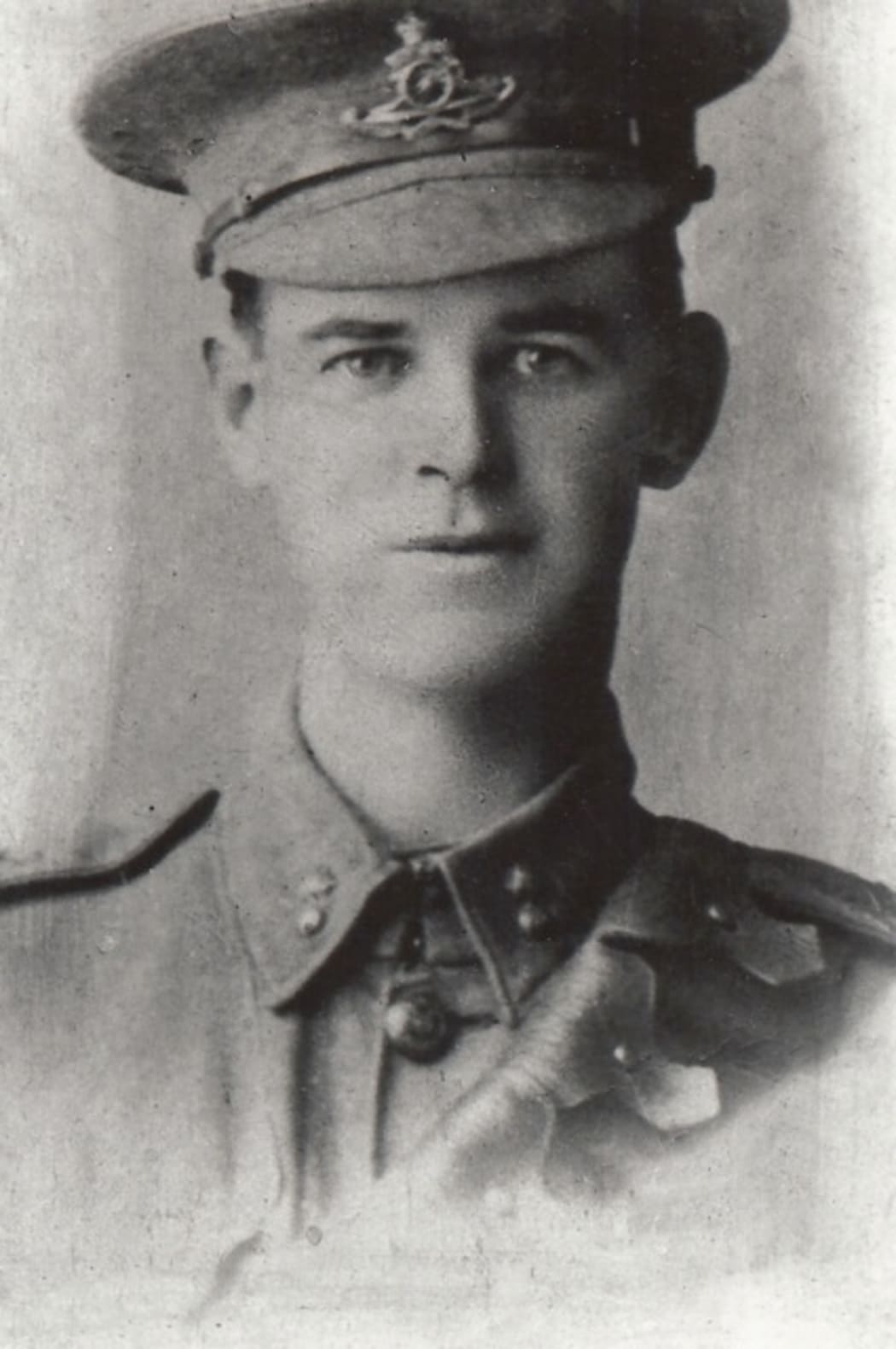 A sepia-tinted portrait of a man in military uniform