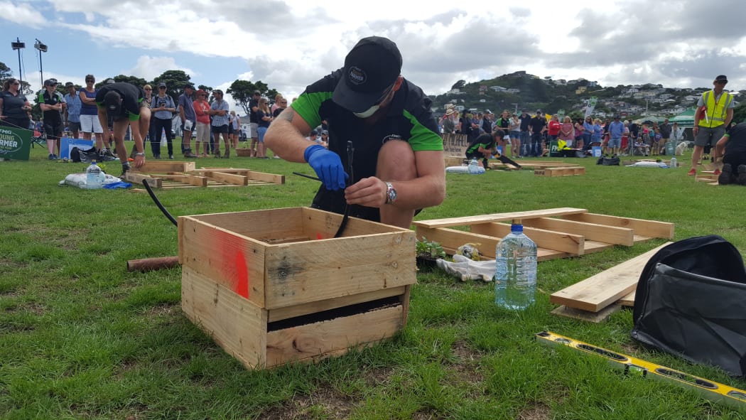 Lachlan Fee finishing his planter box.