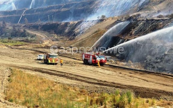 Firefighters battling a blaze at the Hazelwood open cut coal mine near Morwell.