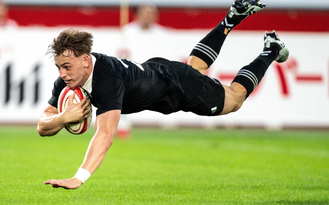 New Zealand's Ruben Love scores a try during the rugby union test match between New Zealand and Japan at Nissan Stadium in Yokohama, Kanagawa prefecture, south of Tokyo on October 26, 2024. (Photo by Philip FONG / AFP)