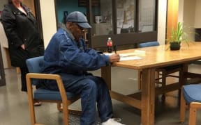 OJ Simpson signed release documents before walking out of a Nevada jail just after midnight, local time