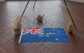 An artwork at the Hastings Art Gallery inviting people to walk on the New Zealand flag has raised concerns from a Hastings District Councillor and a local resident.