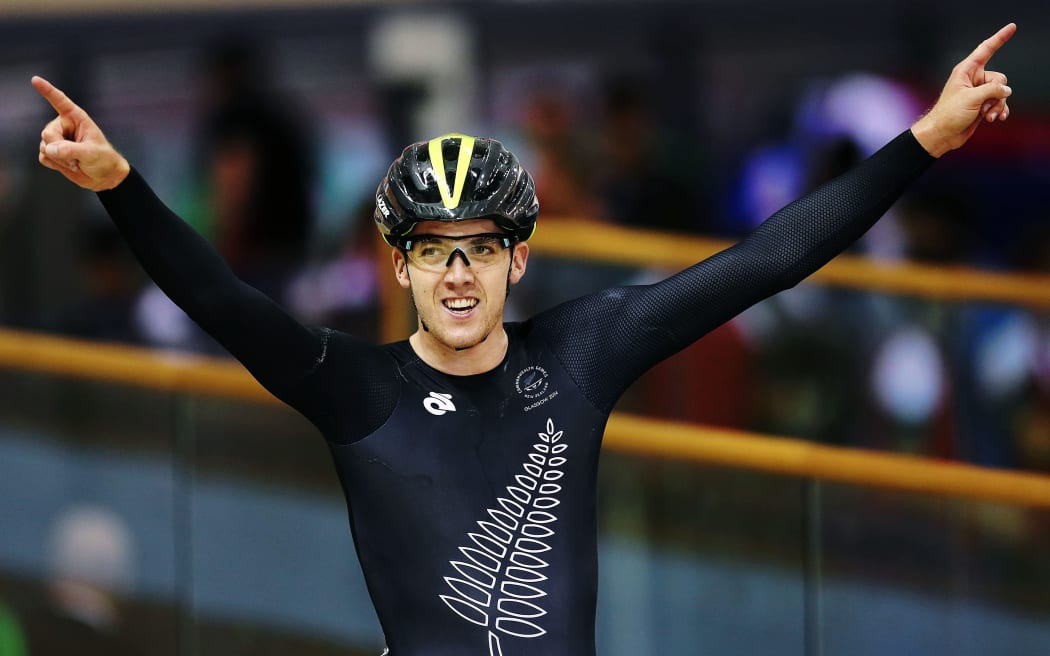 Thomas Scully of New Zealand wins gold in the Mens 40km Points Race. Glasgow 2014 Commonwealth Games, cycling track.