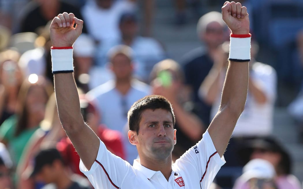 The Serbian tennis player Novak Djokovic wins a match at the 2014 US Open.