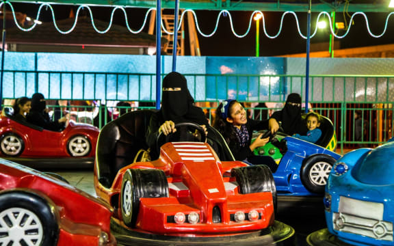 To mark the 125th anniversary of women's suffrage in New Zealand, the City Gallery presented the work of a woman artist from the last country to give women the vote, Saudi Arabia. Arwa Alneami’s images are of Saudi women at an amusement park.