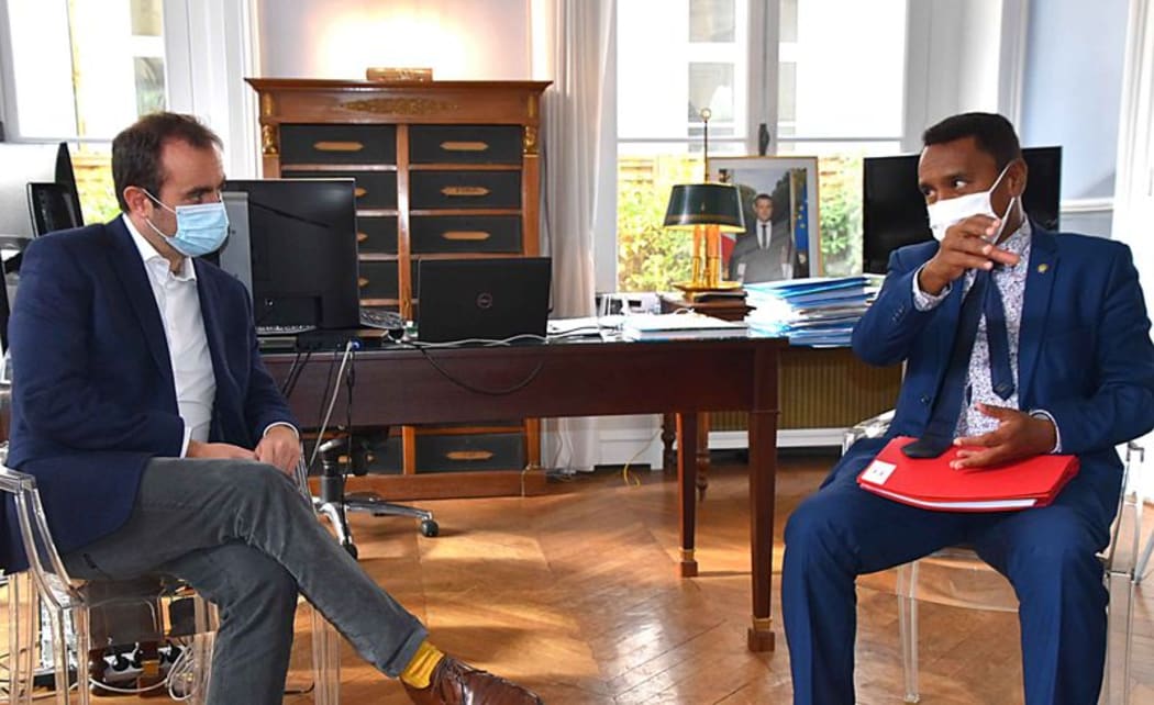 Sebastien Lecornu (left) in talks with Teraii Alpha