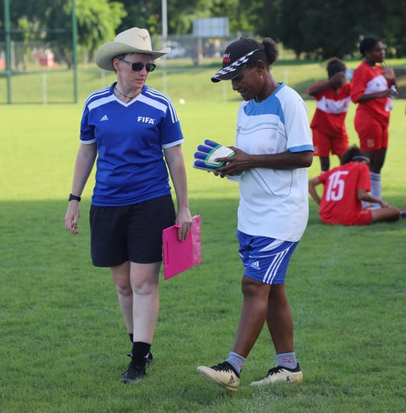 Nicole Demaine on the left at a training session