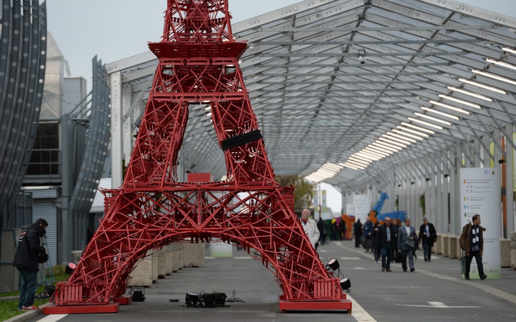 A replica of the Eiffel Tower built from bistrot chairs is installed at the COP21 climate summit's venue at Le Bourget, northeast of Paris.