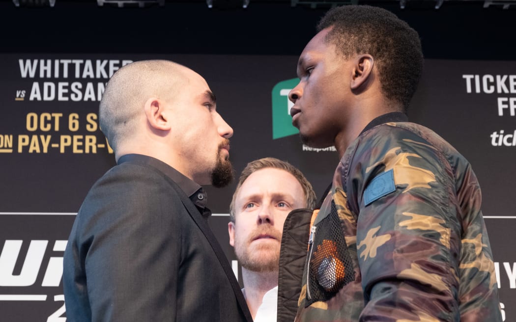Robert Whittaker and Israel Adesanya face off.