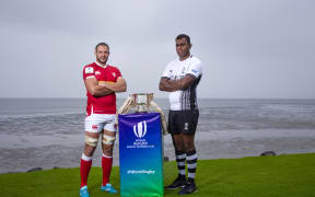 Canada's Tyler Ardron and Fiji's Leone Nakarawa pose with the World Rugby Pacific Nations Cup.